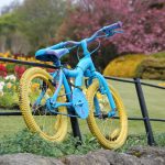 photo cycle yellow wheels and blue frame on tour de yorkshire