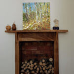 trees in golden light acrylic painting on fireplace