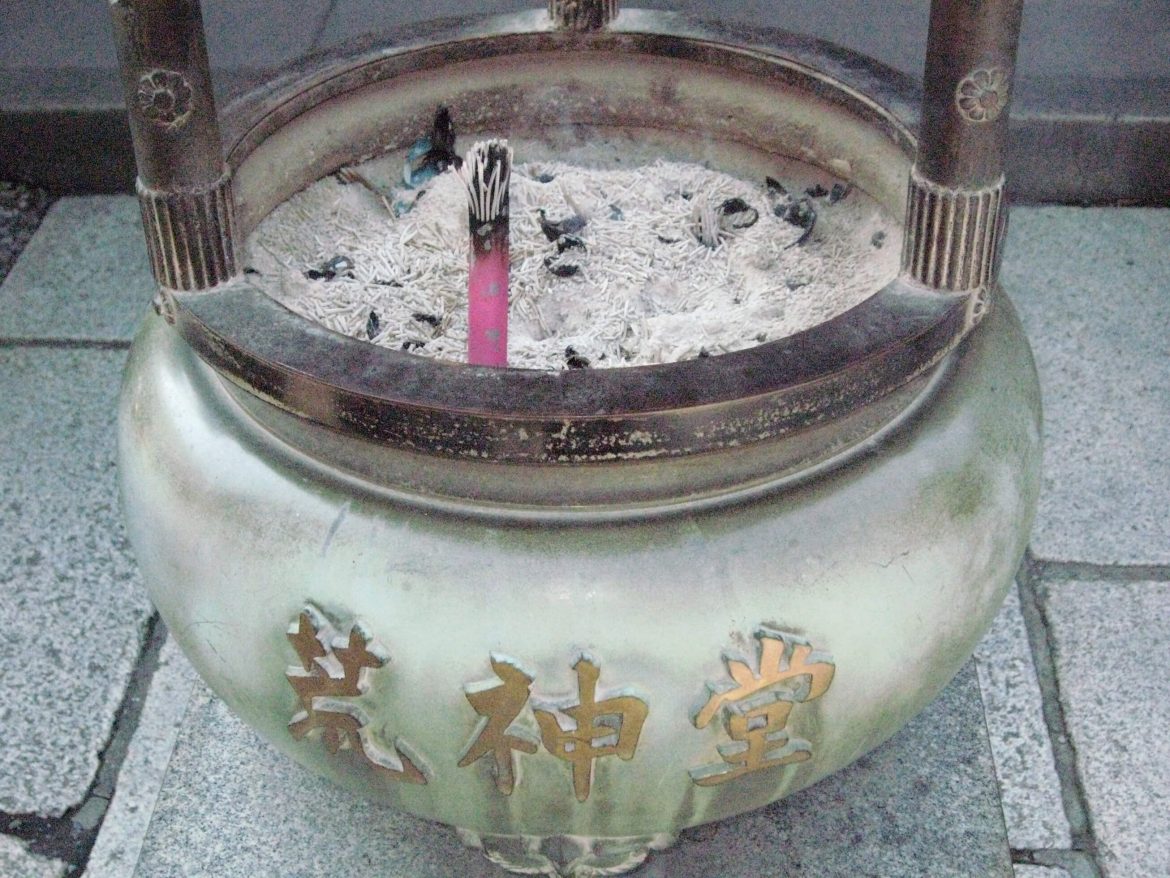 taken in japan white pot with candle and ash in japan in photo by kathryn sassall