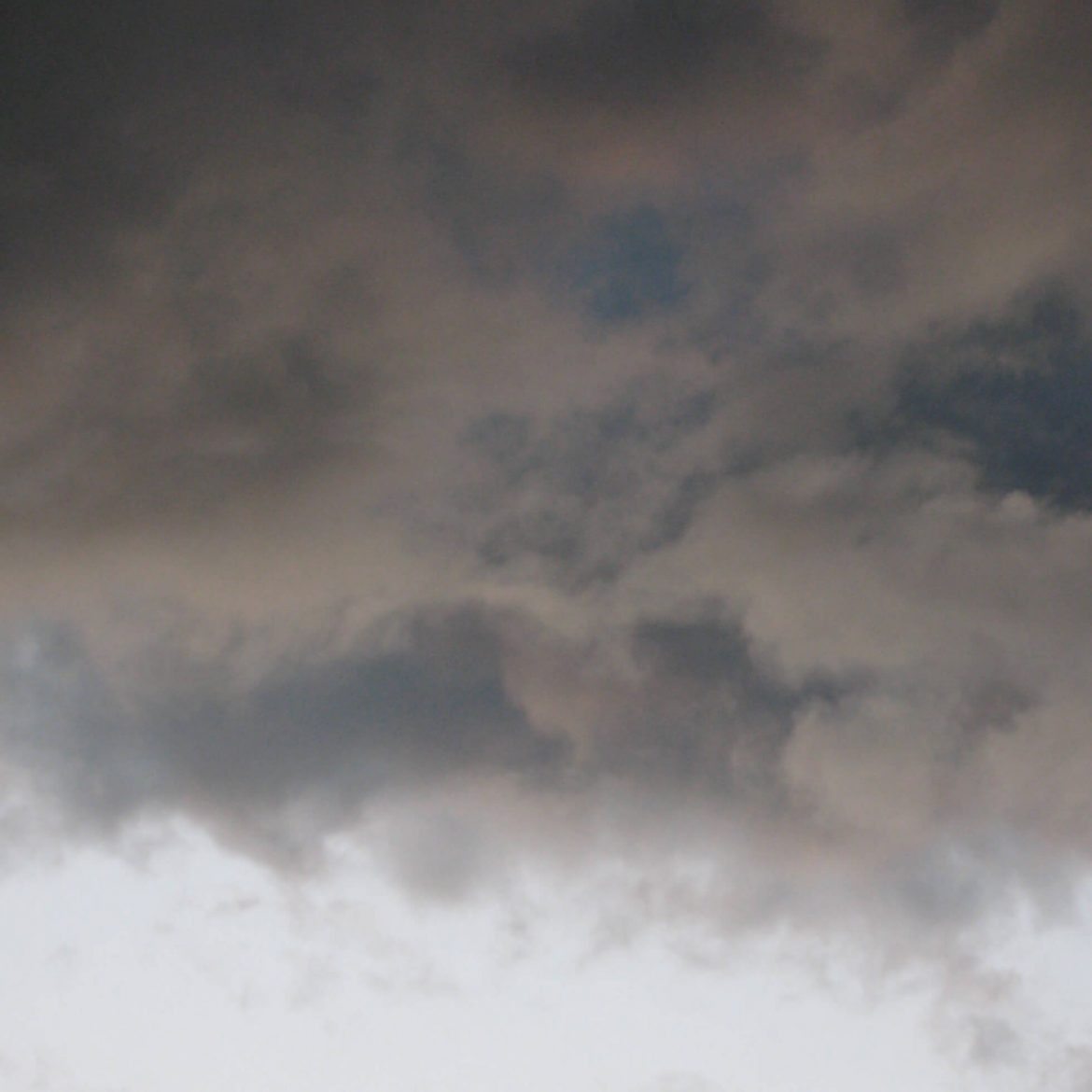 photograph of grey rolling clouds by kathryn sassall