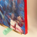 photo of edge of painting of a swing chair