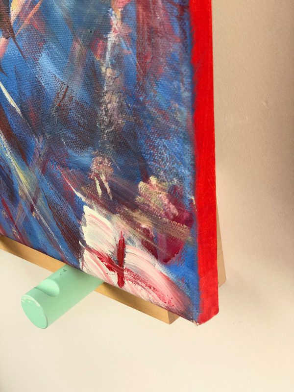 photo of edge of painting of a swing chair